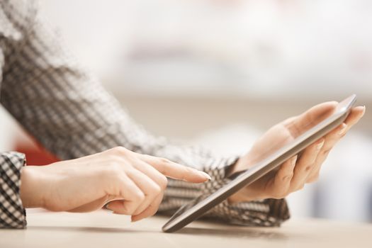 Businesswoman at office working with digital tablet