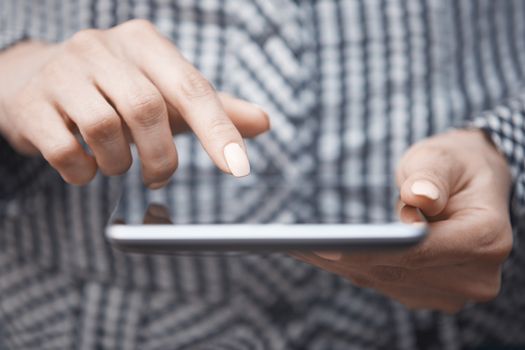 Hands of woman using digital tablet