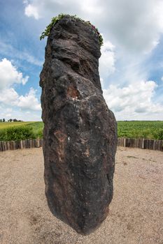 Menhir Stone Shepherd (also Stone Man, Petrified Man or Petrified minister) is a menhir standing alone in a field 1 km northwest of the village Klobuky, district Kladno. This is the highest menhir in the Czech Republic.  3.5 m tall columnar rock uncut dark iron Cretaceous sandstone. This is one of the few stones in the country, which we can with high probability be considered a real prehistoric menhir.