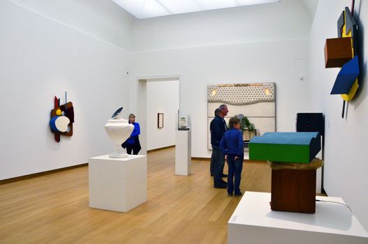 Amsterdam, Netherlands - May 6, 2015: People visit Exhibition in Stedelijk Museum in Amsterdam located in the museum park, Netherlands on May 6, 2015