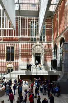 Amsterdam, Netherlands - May 6, 2015: Tourists in the modern atrium Rijksmuseum on May 6, 2015. The original interior courtyards have been redesigned to create the imposing new entrance space of the Atrium