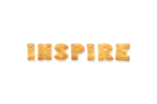 Collage of the character word INSPIRE. Alphabet cookie cracker isolated on white background
