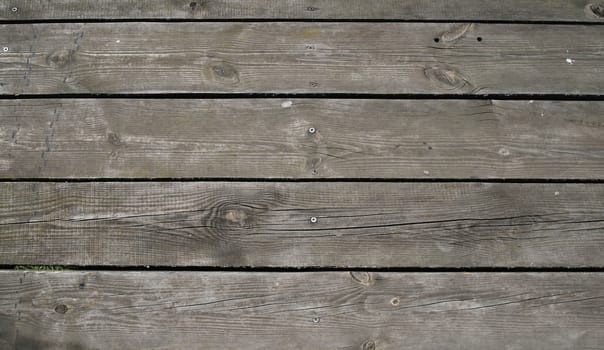 Old vintage rustic aged antique wooden sepia panel with horizontal gaps, planks and chinks