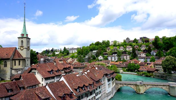 Scene of historical old town city and church and river on bridge in Bern, Switzerland