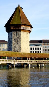 close up tower and wooden Chapel Bridge in Lucerne, Switzerland