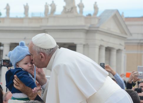 VATICAN CITY: Pope Francis kisses a young child, as he arrives at his general audience address in Saint Peter's Square, Vatican City on Sept. 30, 2015. Pope Francis reflected on his recent apostolic trip to Cuba and the United States. 