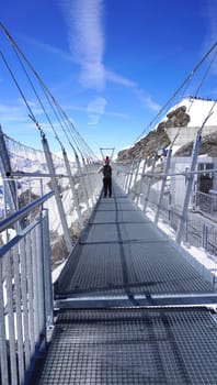 Suspended walkway snow mountains Titlis, Engelberg, Switzerland