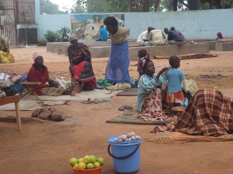 CENTRAL AFRICAN REPUBLIC, Bangui: Displaced women and children are pictured in Evangelic Theology Faculty of Bangui (Faculte de Theologie Evangelique de Bangui, FATEB, in French), on September 30, 2015. These families ran away the neighborhoods hit by renewed violence since September 26. The Central African Republic descended into bloodshed more than two years ago after long time president Francois Bozize, a Christian, was ousted by Seleka rebels, triggering the worst crisis since independence in 1960. On September 29, 2015, Bangui returned to only relative calm after three days of inter-community violence which left at least 40 dead and 100 injured according to the UN Refugee Agency UNHCR. Some 27,000 inhabitants of Bangui have also fled to displaced people's camps.