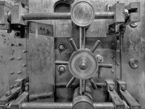 Old Bank Vault in Basement of Historic Building in Black and White Grunge Texture Closeup