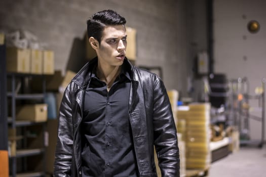 Close up Face of a Handsome Vampire Man in Leather Clothing, with Blood on his Mouth, Looking Away to a Side