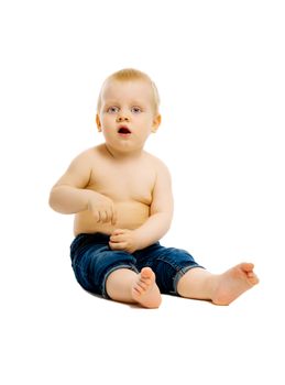 baby boy sitting on the floor. Studio. isolated