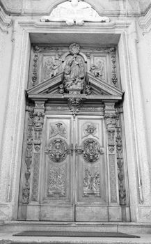 carved wooden portal of an italian church