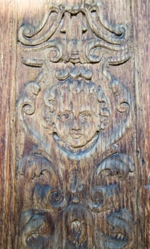 carved wooden portal of an italian church