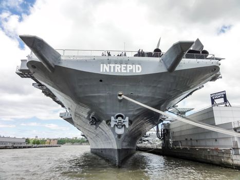 aircraft carrier docked at the pier