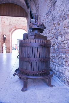 old wooden manual press used to press the grapes and make wine in Italy