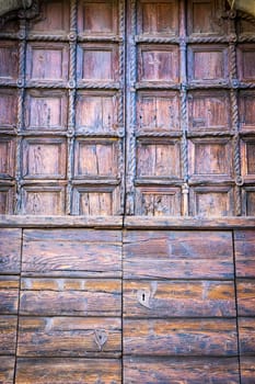 carved wooden portal of an italian palace