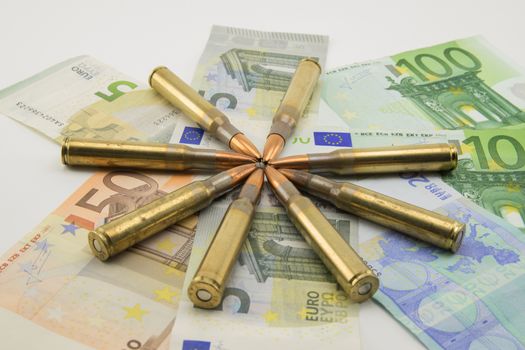 composition with bullets and banknotes