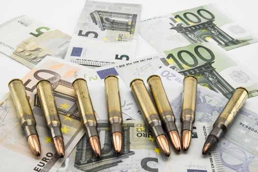 composition with bullets and banknotes