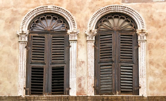 two old windows in the center of Verona, Italy