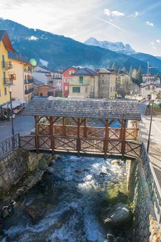 wooden pedestrian bridge over the river