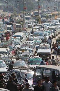 NEPAL, Kathmandu: Shortage of fuel and other supplies caused by the closure of border crossings between India and Nepal has prompted Nepalese residents to join long lines for petrol in Kathmandu, Nepal on September 30, 2015. Nepal has blamed a blockade by the Indian government for the closures, but India says the disruptions to trade are due to widespread unrest in Nepal following the enactment of its new constitution on September 20. The fuel crisis has forced the government to limit driving around Nepal, while some international airlines have cancelled flights to the country. 