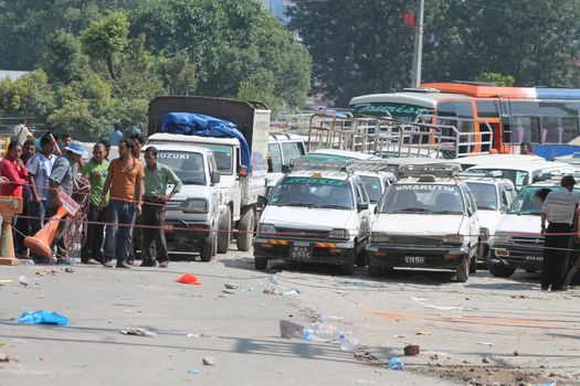 NEPAL, Kathmandu: Shortage of fuel and other supplies caused by the closure of border crossings between India and Nepal has prompted Nepalese residents to join long lines for petrol in Kathmandu, Nepal on September 30, 2015. Nepal has blamed a blockade by the Indian government for the closures, but India says the disruptions to trade are due to widespread unrest in Nepal following the enactment of its new constitution on September 20. The fuel crisis has forced the government to limit driving around Nepal, while some international airlines have cancelled flights to the country. 