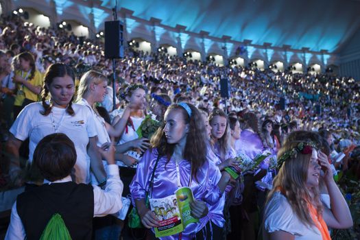 RIGA, LATVIA - JULY 10, 2010: Grand Concert of Latvian Youth Song and Dance Celebration in the Grand Stage of Mezaparks. Low light photo some digital noise present.