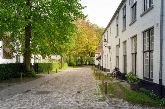 White houses in the Beguinage (Begijnhof) in Bruges, Belgium. 