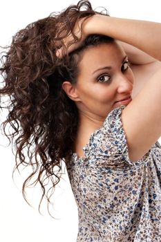 Beautiful young woman touching him the hair and looking at the camera