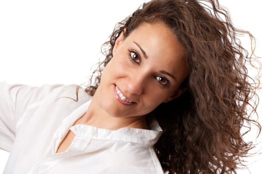 Happy young woman with curly hair in the wind. Isolated on white