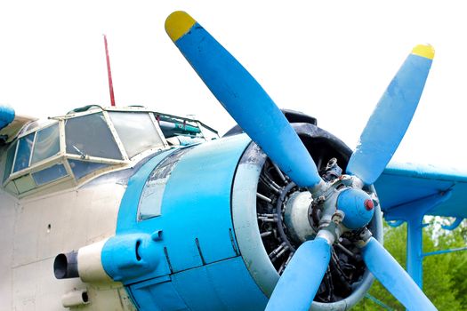 Old retro airplane on green grass field