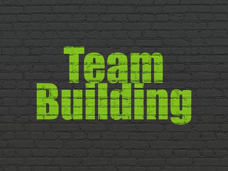 Business concept: Painted green text Team Building on Black Brick wall background