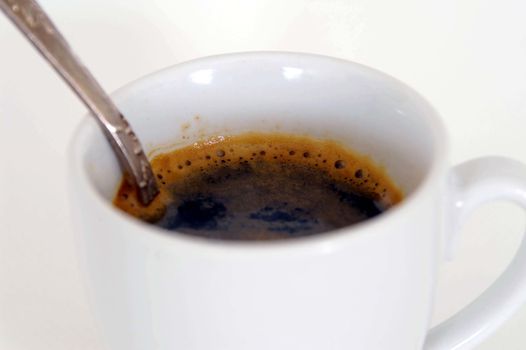 Coffee cup with a spoon, isolated