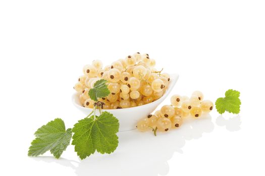 Delicious white currant in bowl isolated on white background. Healthy summer fruit eating. 