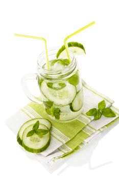 Cucumber lemonade isolated on white background. Healthy summer drink.