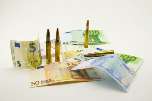 composition with bullets and banknotes