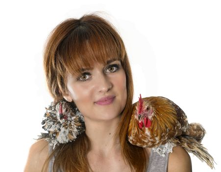 young woman and chicken in front of white background