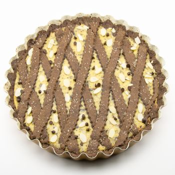 freshly baked cocoa tart with ricotta cheese and chocolate