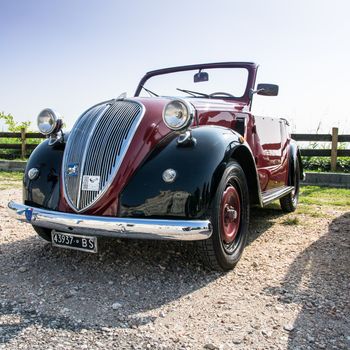 VERONA, ITALY - SEPTEMBER 27: Topolino car. Topolino Autoclub Italia organizes a gathering on Lake Garda Sunday, September 27, 2014. Cars and enthusiasts from all over Italy.