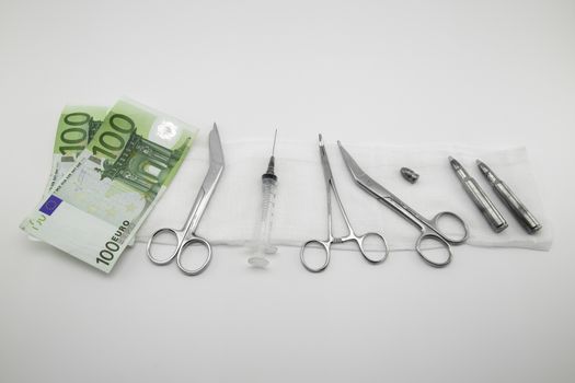 surgical instruments, syringe, ammunitions, money on white background