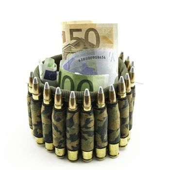 composition with bullets and banknotes on white background