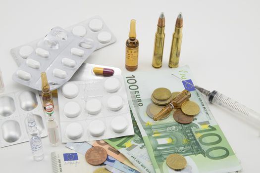 composition with euros, bullets, drugs and syringe