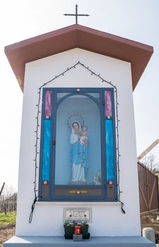 Italian traditional votive temple in the countryside dedicated to the Virgin Mary to propitiate the harvest