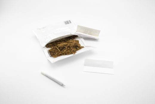 ready to make an hand made cigarette on white background