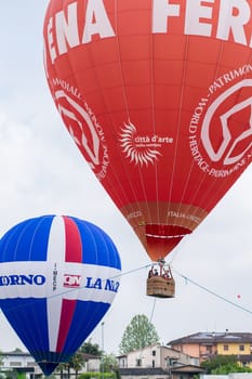 FERRARA, ITALY - SEPTEMBER 13: Ferrara ballon festival is a major annual gathering for fans of hot air balloons and paragliders on Ferrara Saturday, September 13, 2014.