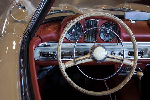 red leather dashboard of a vintage car