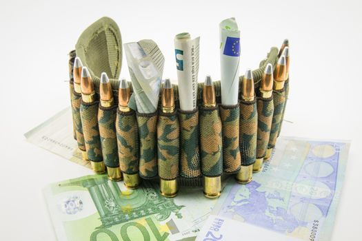 composition with a camouflage belt, bullets and banknotes