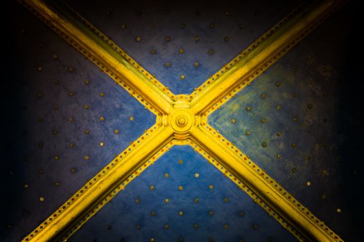 antique ceiling with gold stars in italian church