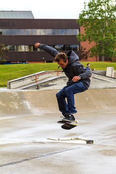 CALGARY, CANADA - JUN 21, 2015: Athletes have a friendly skateboard competition in Calgary. California law requires anyone under the age of 18 to wear a helmet while riding a skateboard.