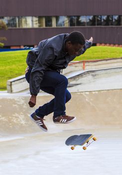 CALGARY, CANADA - JUN 21, 2015: Athletes have a friendly skateboard competition in Calgary. California law requires anyone under the age of 18 to wear a helmet while riding a skateboard.